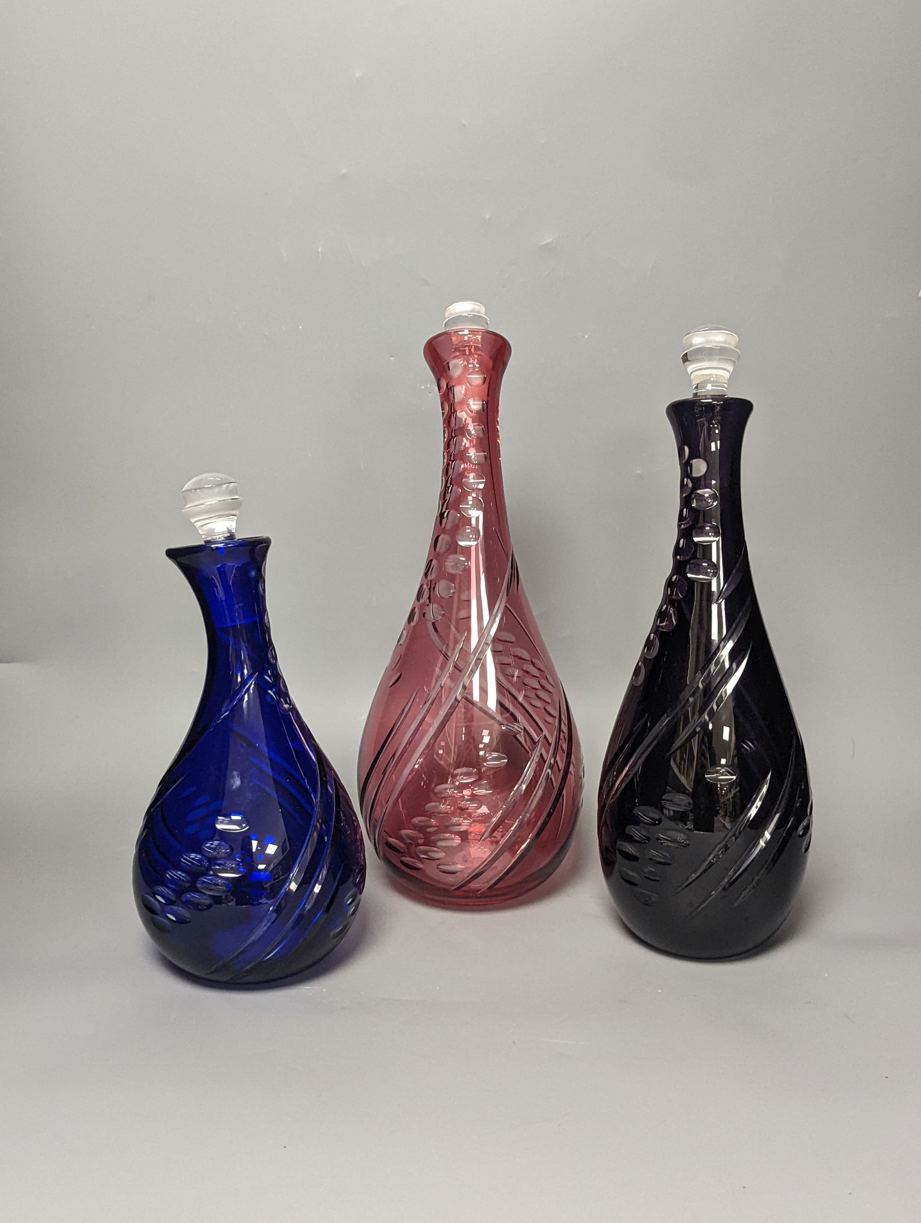 Three Bohemian style glass decanters by Stephen Bradley 37cm